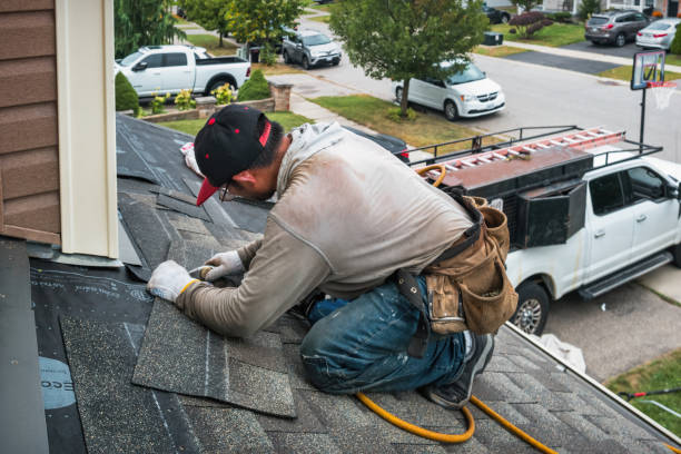 Professional Roof Replacement technician working in Raymond, NH